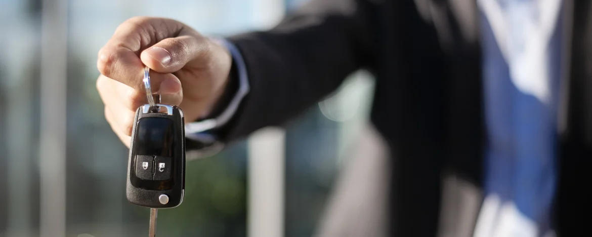 Handing over car keys outside showroom