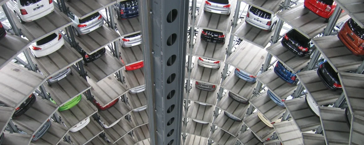 Vehicles parked inside elevated parking lot