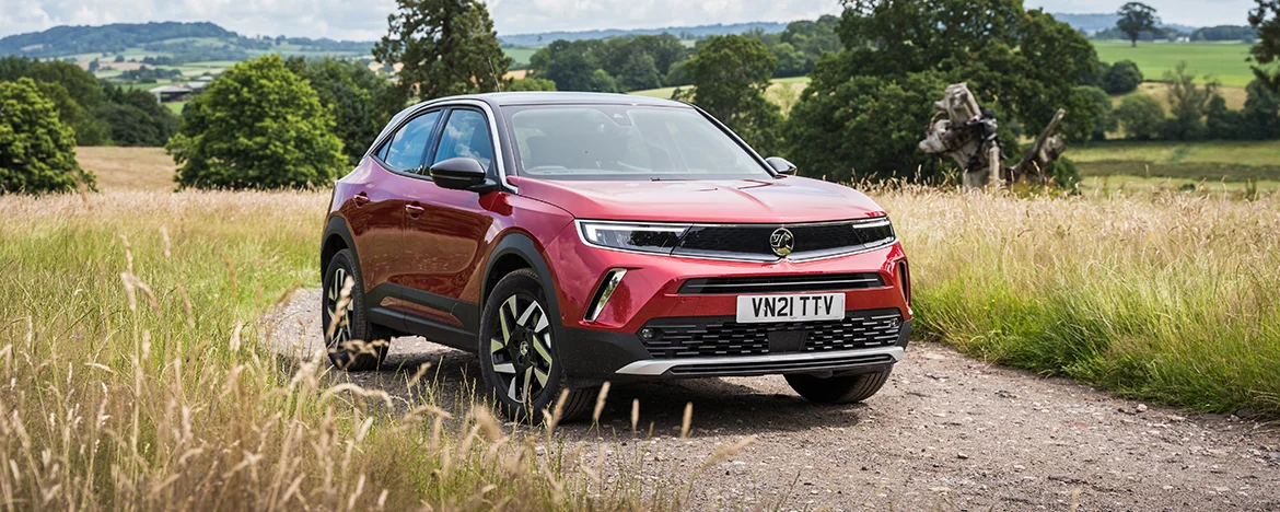 Vauxhall Mokka-e driving in fields