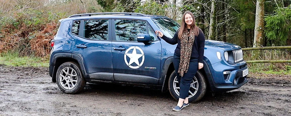 Woman stood next to Jeep Renegade