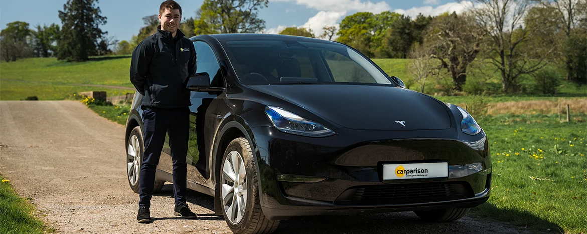 Man stood with Tesla Model Y