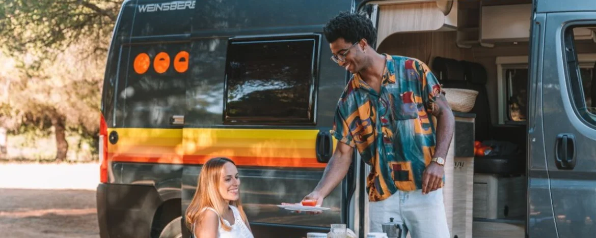 Man and woman outside converted van