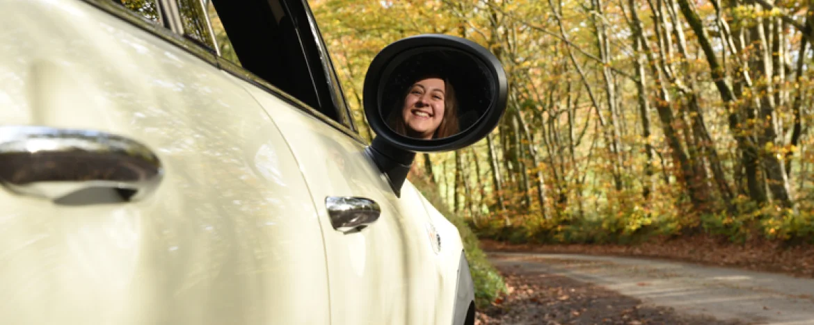 Young person driving new car