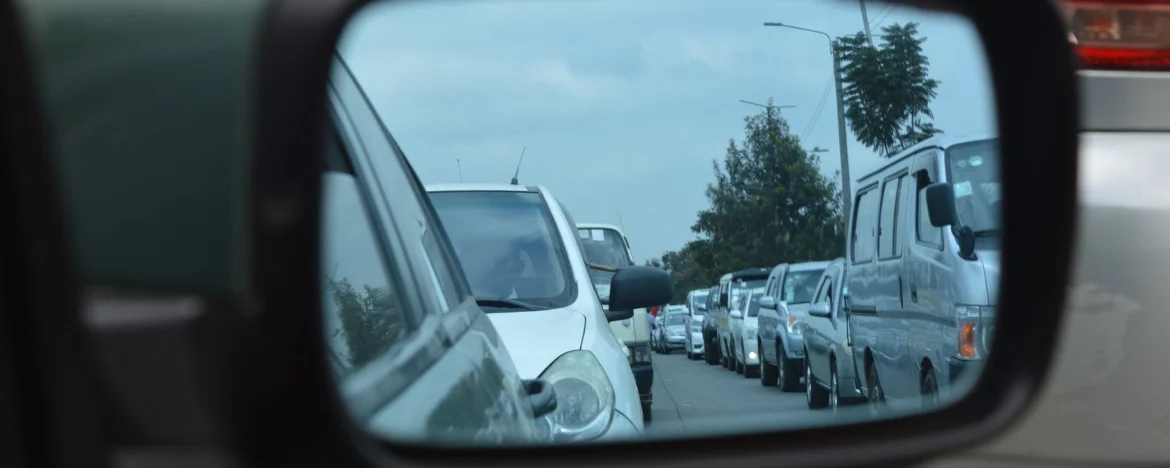 cars in a traffic jam, viewed through a wing mirror