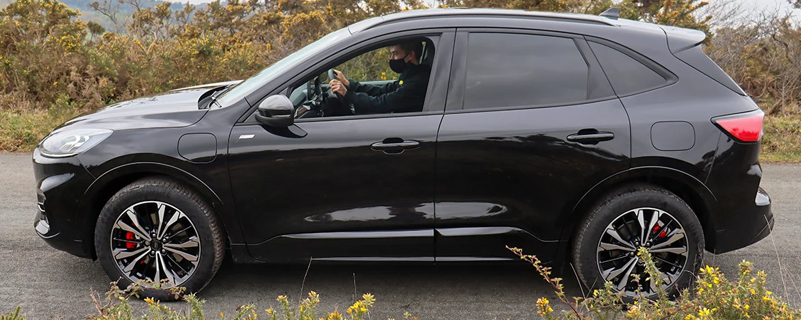 Man-driving-ford-kuga-with-window-down