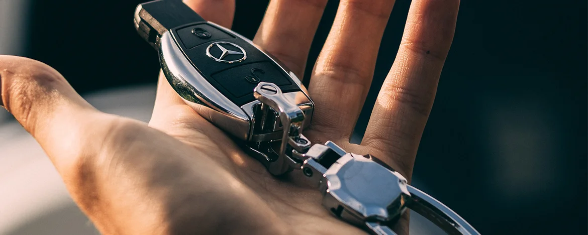 Hand holding car keys