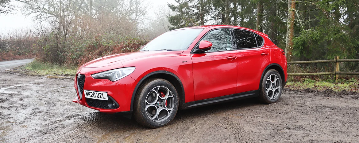 Woman stood next to Alfa Romeo Stelvio