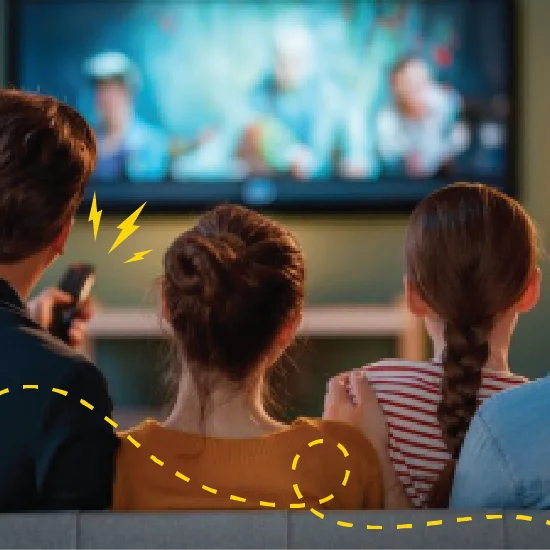 An image of a family watching TV together