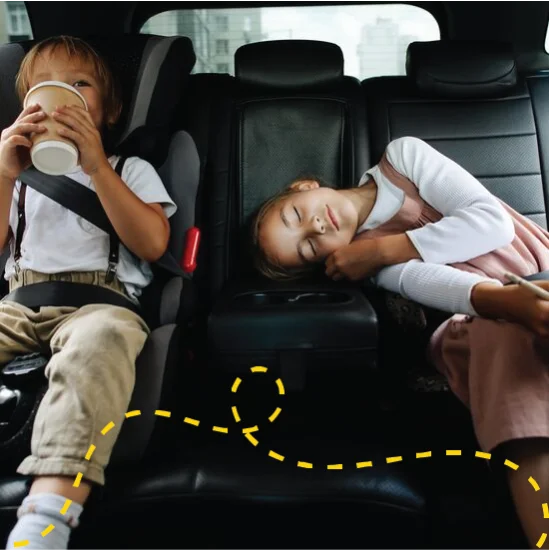 Two children in the back of a car