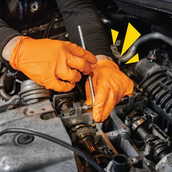 Close up of mechanic hands fixing an engine