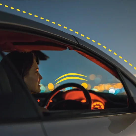 person in car looking at cityscape