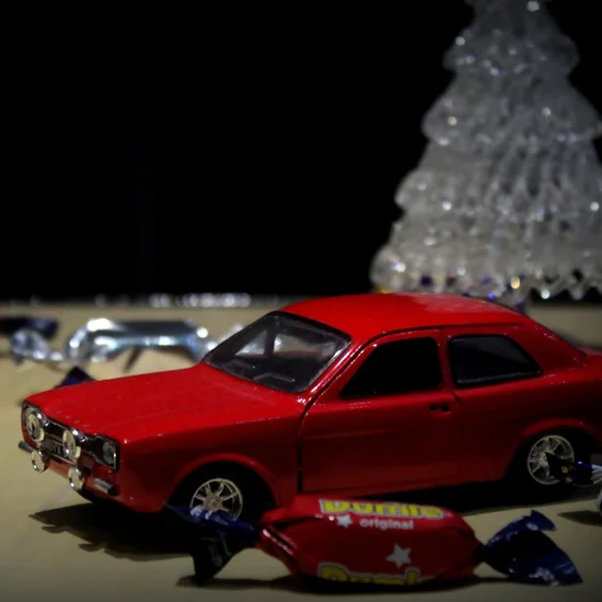 Car toy by christmas tree
