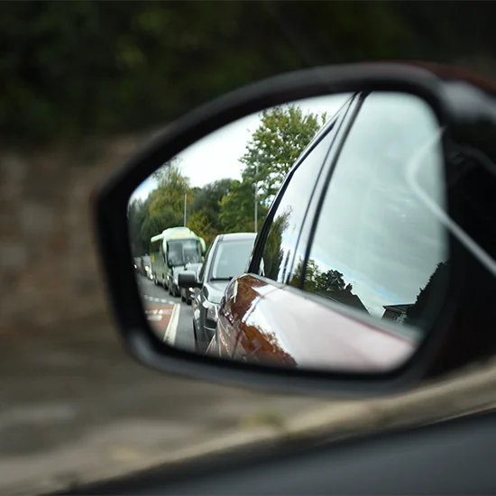 Reflection of cars in wing mirror