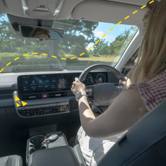 Woman driving electric car