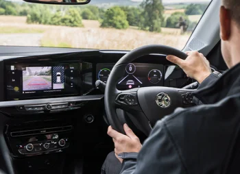 Man driving Vauxhall Mokka-e