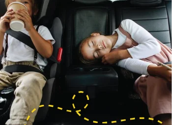 Two children in the back of a car
