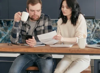 Couple looking at bills