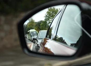Reflection of cars in wing mirror