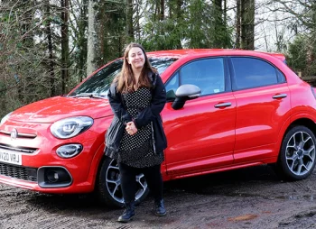 Woman stood beside Fiat 500X