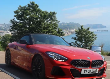 BMW Z4 parked under tree