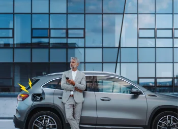 Business man charging EV