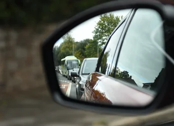 car in wing mirror