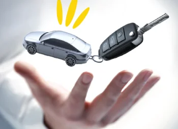 hand with corporate car and car keys above