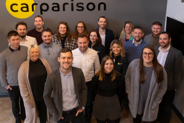 Carparison team photo in new headquarter foyer