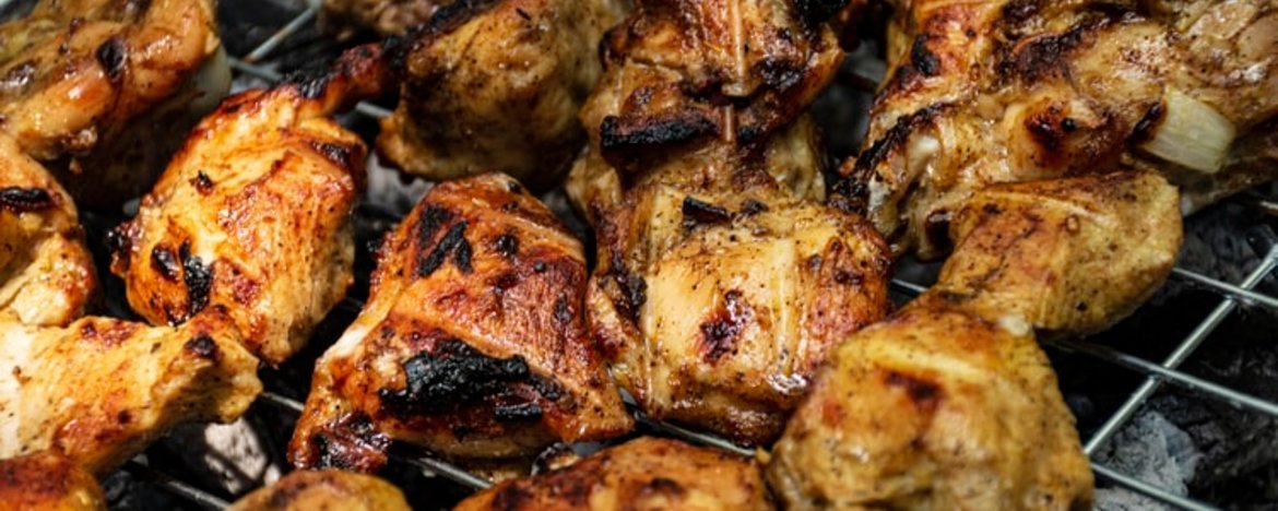Chicken chunks on a barbecue
