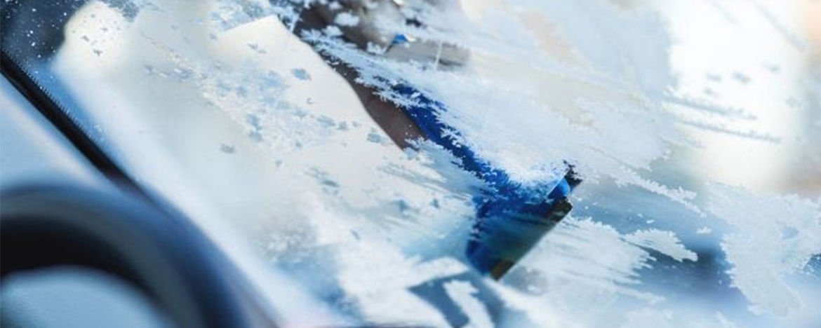 ice scraping a car windscreen