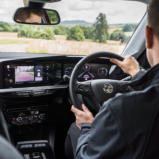 Man driving Vauxhall Mokka-e